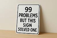 White sign with black writing saying 99 problems but this sign solved one is leaning on a shelf against a wall, AI generated [IBR125421194]