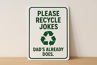 White recycling sign with green writing and symbol suggesting to recycle jokes because dad already does, placed on wooden surface, AI generated [IBR125421195]