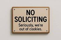 Wooden no soliciting sign on a white wall with the funny message seriously, we're out of cookies, AI generated [IBR125421218]