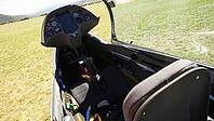 Interior view of a glider cockpit showing instrument panel and seats with sunlight streaming in, Aérodrome de Château-Arnoux - Saint-Auban, France [IBR125421657]