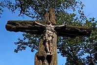Weathered figure of Christ on an old tree cross, Kreuzleshöhe Krummen-Kreuzthal, Baden-Württemberg, Germany [IBR125421682]
