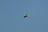 Embraer ERJ-190 jet commercial passenger aircraft of British airways airline flying in a blue sky, England, United Kingdom [IBR125423474]