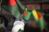 Dhaka, bangladesh- 16 Dec 2025: Bangladesh national flag held during a public celebratory event [IBR125423475]