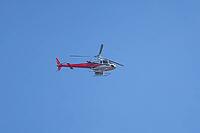 Eurocopter AS 350 B2 helicopter flying in a blue sky, England, United Kingdom [IBR125423493]