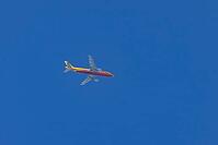 Jet cargo aircraft of DHL airline flying in a blue sky, England, United Kingdom [IBR125423499]