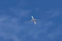 Boeing 777-300ER jet commercial passenger aircraft of Emirates airline flying in a blue sky, England, United Kingdom [IBR125423507]