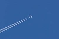 Jet commercial passenger aircraft of KLM airlines flying in a blue sky with contrails or vapour trails behind in the atmosphere, England, United Kingdom [IBR125423513]