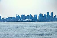 A panoramic view of the Vancouver cityscape featuring modern skyscrapers and large cruise ships docked along the harbor, Chadwick City, 220, Noth Vancouver, BC, Canada [IBR125424481]