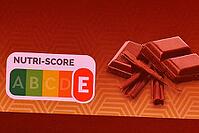 Nutri Score, a five-color nutrition label and nutritional rating system that provides consumers with information on the overall nutritional quality of products with letters from A to E on the front of food packaging, logo on a chocolate, Nutri Score E, No [IBR125424488]