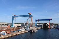 Kiel, Germany - 12. August 2026: German Naval Yards shipyard features cranes and docks for constructing ships [IBR125424511]