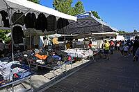 Lively market activity at an Italian weekly market market [IBR125436236]