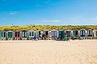 Sandy beach beach with beach huts and blue sky, Wijk aan Zee, North Sea, North Holland, Netherlands [IBR125436268]