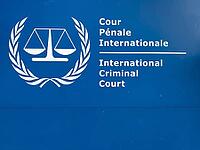 Close-up of the official logo and lettering of the International Criminal Court (The Hague) on a blue sign, The Hague, Netherlands [IBR125436275]