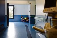 Boy playing with children's toys in a hospital corner, Portugal [IBR125448831]