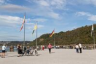 Tourists at the Deutsches Eck attraction in summer autumn weather at the confluence of the Moselle and Rhine rivers, Koblenz, Germany [IBR125448853]