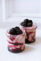 Creamy summer sundae dessert pots with berries and greek yogurt [IBR125462053]