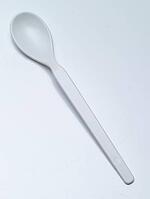 White children's spoon against a white background, studio shot [IBR125462069]