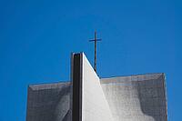 Architecture detail with cross on a modern church building against blue sky [IBR125462088]