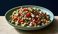 Fresh chickpea salad with tomatoes, cucumber, feta, and parsley. Vibrant bowl on wooden surface. Dark blue background adds contrast, AI generated [IBR125472252]