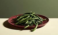 Fresh green beans on a red plate. Beans are bright green and plump. Plate sits on a neutral background. Simple food photography with soft lighting, AI generated [IBR125472256]
