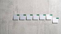 Row of blank sticky notes on grey concrete wall, green arrow markers all pointing right, alignment and clear plan concept, copy space, AI generated [IBR125472284]