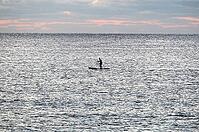 A man paddles with his stand up paddle in front of Tortoli beach, Sardinia, 29.09.2026, Tortoli, Italy [IBR113453105]