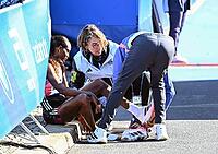 27 September 2026, Athletics: BMW Berlin Marathon 2026, from left: Tigst Assefa (ETH 2:11:04) crosses the finish line exhausted to take first place at the 2026 BMW Berlin Marathon [IBR113453142]