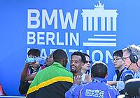 27 September 2026, Athletics: BMW Berlin Marathon 2026 – from left to right: Gabriel Gerald Geay (TAN), 3rd place, and Gemechu Dida Diriba (ETH), 2nd place, congratulate one another at the 2026 BMW BERLIN MARATHON [IBR113453147]