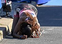 27 September 2026, Athletics: BMW Berlin Marathon 2026, from left: Tigst Assefa (ETH 2:11:04) crosses the finish line exhausted to take first place at the 2026 BMW Berlin Marathon [IBR113453173]