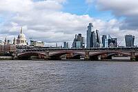 View of the River Thames in London with St. Pauls Cathedral and the skyscrapers of the city [IBR125492327]
