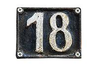Old retro weathered cast iron plate with number 18 isolated on white background [IBR125492339]