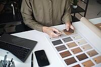 Architecture and Interior Designer man choosing interior materials [IBR125492390]