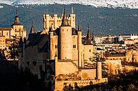 A beautiful view of the Alcazar of Segovia, Spain, with the Guadarrama mountain range visible in the background on a sunny day [IBR125492415]