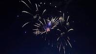 Colorful fireworks exploding in the dark night sky, creating a spectacular display of light and color during a festive celebration [IBR125501571]