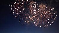 Colorful fireworks exploding in the night sky, creating a spectacular display of light and color during a festive celebration [IBR125501640]