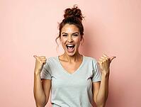 Excited young woman pointing sideways with both thumbs and cheerfully yelling, expressing excitement and enthusiasm on a pastel pink background, AI generated [IBR125502148]