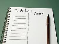 Notebook page with to-do list and relax sections for prioritizing tasks and leisure time, AI generated [IBR125502151]