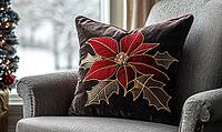Dark chocolate pillow with bright red poinsettia and gold stitching, on a warm gray armchair, AI generated [IBR125502162]
