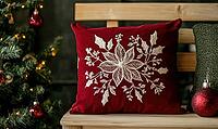 Dark red pillow with delicate white poinsettia embroidery on a light wooden bench, AI generated [IBR125502172]