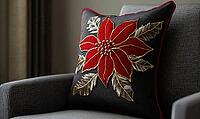 Dark chocolate pillow with bright red poinsettia and gold stitching, on a warm gray armchair, AI generated [IBR125502178]