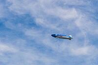A blue airship with advertising inscription floats in front of a light blue, cloudy sky, Zeppelin, ZF, Konstanz am Lake Constance, Baden-Württemberg, Germany [IBR125521082]