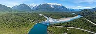 Bridge, river Rio Frio and Rio Yelcho at the end of Lago Yelcho, picturesque mountains with snow-capped peaks, Puerto Cardénas, Carretera Austral, Patagonia, Los Lagos, Chile [IBR125521094]