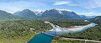 Bridge, river Rio Frio and Rio Yelcho at the end of Lago Yelcho, picturesque mountains with snow-capped peaks, Puerto Cardénas, Carretera Austral, Patagonia, Los Lagos, Chile [IBR125521105]