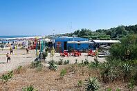 Sandy beach beach with sunbeds and umbrellas at the Bagno Vela beach house on the Adriatic Sea, Punta Marina, Ravenna, Emilia-Romagna, Italy [IBR125521177]