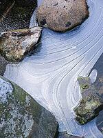Stones in a frozen stream Stones in a frog creek [IBR125527024]