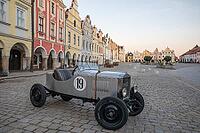 03 October 2026, A vintage Praga race car is parked on the historic cobblestone main square at sunset in Telč, Czech Republic [IBR125527034]