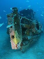 Sunken tugboat John de Vaca on a sandy bottom becomes an artificial reef. Background blue and many fish. Carriacou, Grenada, Caribbean [IBR125527056]