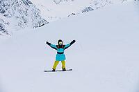 Handsome man smiling at ski resort, rider portrait. Happy tourist on vacation [IBR125527082]