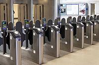 Row of automated ticket barriers and electronic turnstiles at a public subway station entrance with contactless card readers. London, UK, 11 February 2024 [IBR125527084]