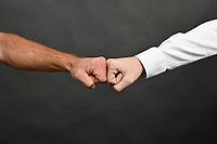 Collision of two fists. Competition or approval concept [IBR125527099]